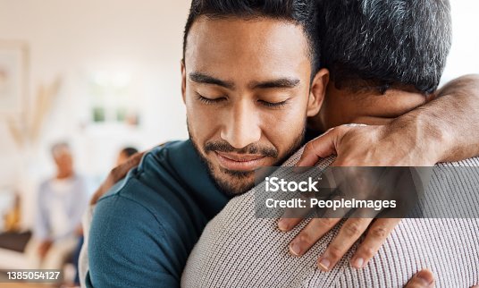 istock Shot of a father and son hugging at home 1385054127