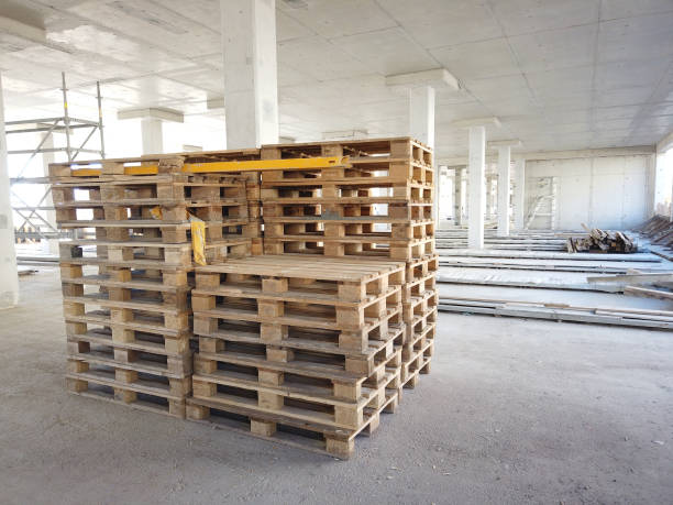 istock Wooden pallets at construction site 1385058748
