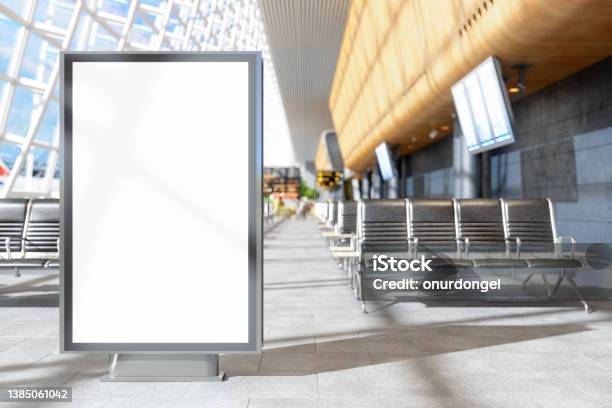 Blank Billboard At Airport With Seats And Blurred Background Stock Photo - Download Image Now