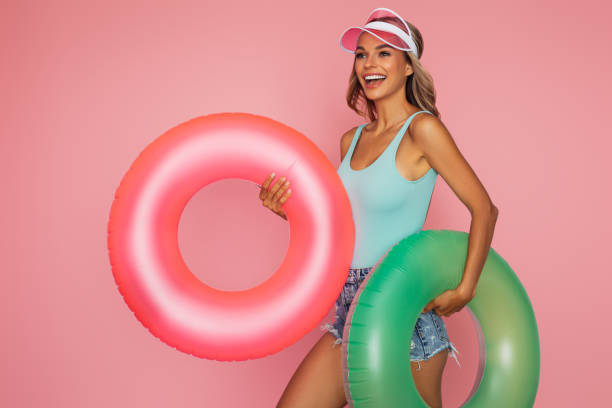 istock Beautiful smiling girl ready for the beach 1385062668