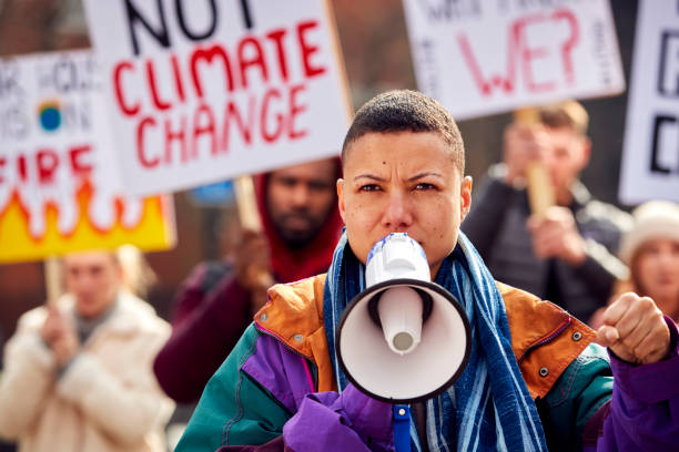 istock Group Of Protestors With Placards On Demonstration March Against Climate Chane 1385063759