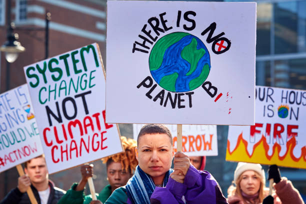 istock Group Of Protestors With Placards On Demonstration March Against Climate Chane 1385063862