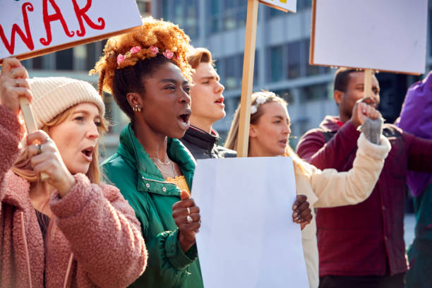 istock Group Of Protestors With Placards On Demonstration March 1385064002