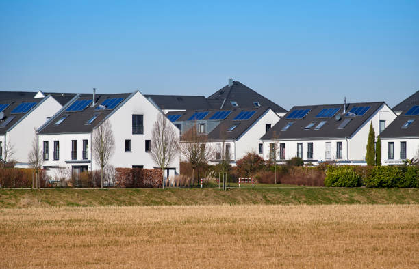 istock Contemporary white row houses with solar panels 1385064167