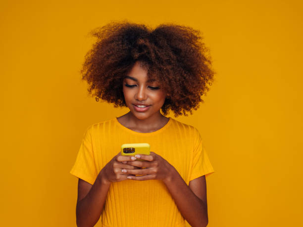 istock Woman holding a smart phone 1385064936