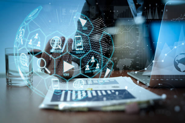 istock business man hand working on laptop computer with digital layer business strategy. 1385065346