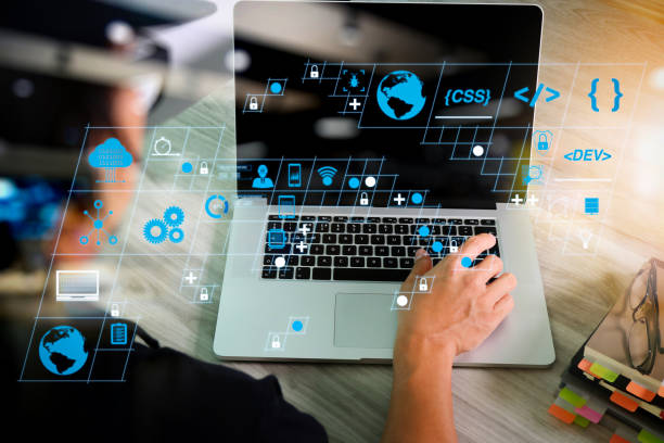 istock business man hand working on blank screen laptop computer and digital tablet and smart phone on wooden desk as concept 1385065387