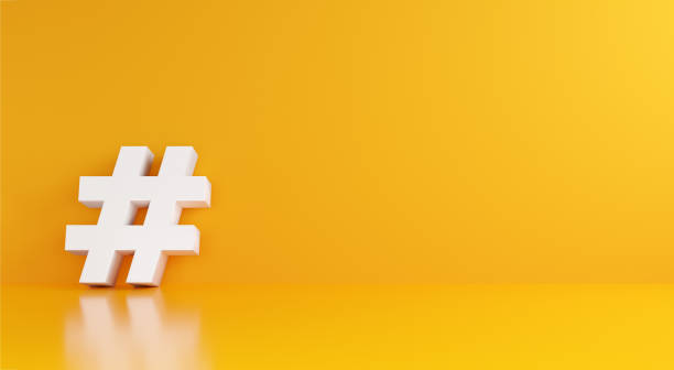 istock White hashtag symbol on yellow background. 1385065641