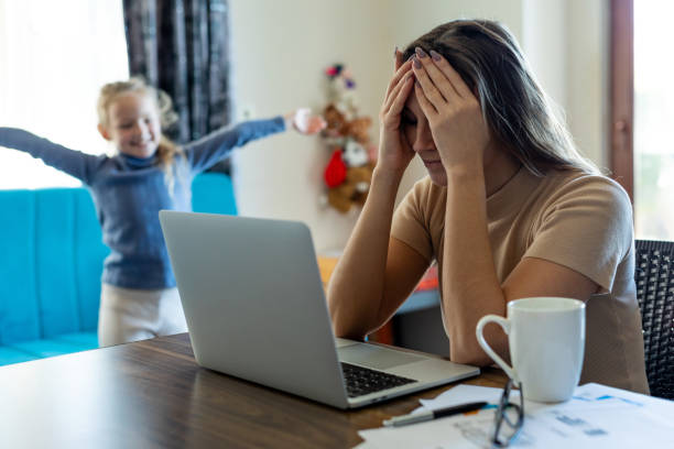 istock Busy mother working from home with daughter 1385066913