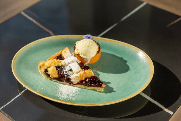 istock Cherry pie served with vanilla ice cream 1385067529