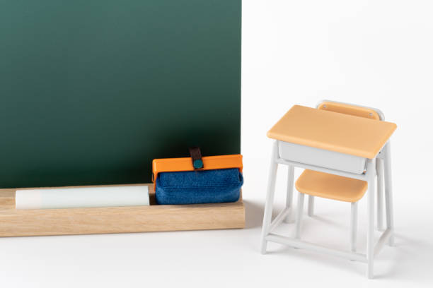 istock Miniature blackboard and desk 1385068710