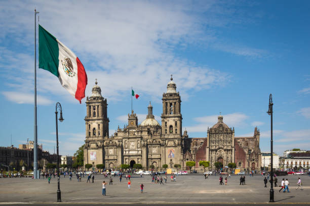istock flag and cathedral on Mexico City's main square (zócalo) 1385071604