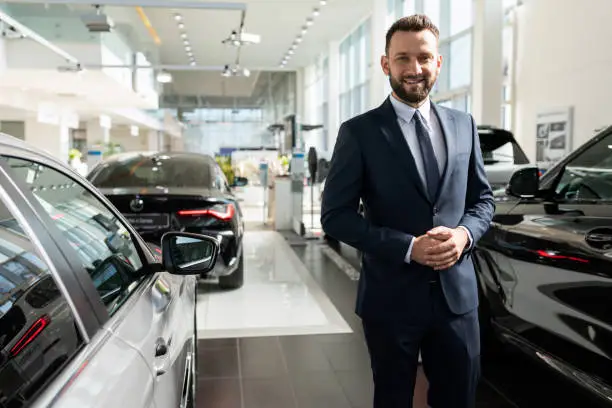 Photo of the concept of an individual approach to each client in a car dealership when buying a new car on credit or leasing