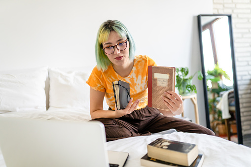 Young woman who joins online book club expresses her opinion about the novel she is reading