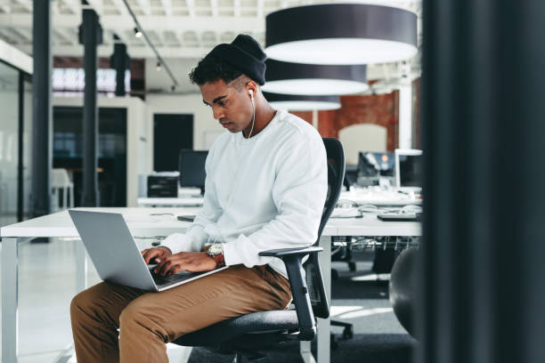istock Male programmer working on a new project in an office 1385075640