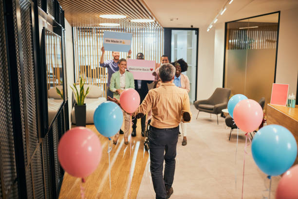 istock Businesspeople at Welcome back party at workplace 1385077786
