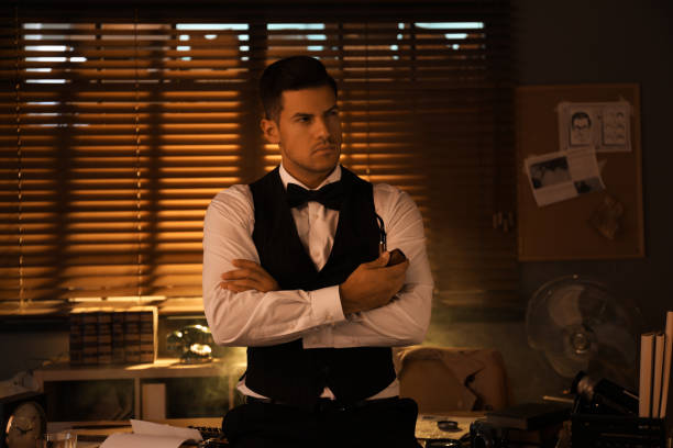 istock Old fashioned detective with smoking pipe in office 1385080499