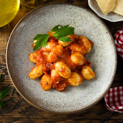 Homemade gnocchi with tomato sauce and cheese