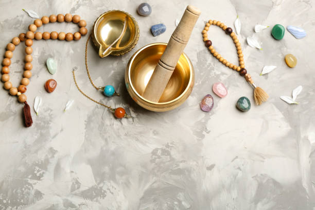 istock Flat lay composition with golden singing bowl on grey table, space for text. Sound healing 1385082386