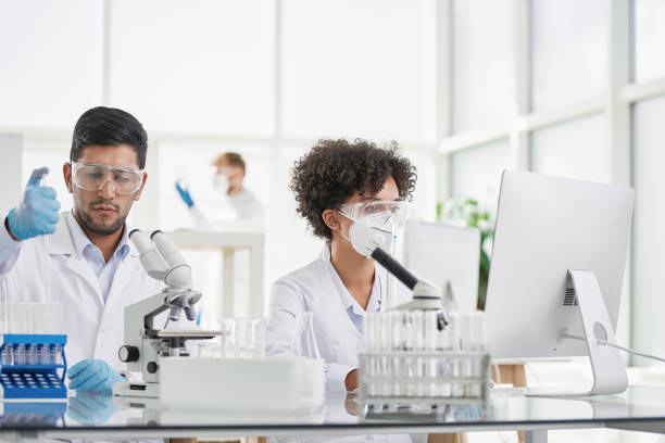 istock group of employees testing samples in the laboratory 1385084953