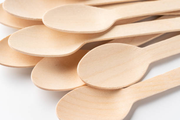 istock Disposable wooden spoon on white background 1385085882