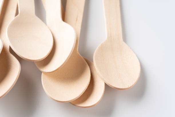 istock Disposable wooden spoon on white background 1385085930
