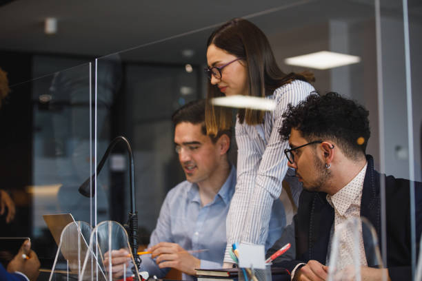 istock Three young business colleagues looking at data on laptop 1385086798