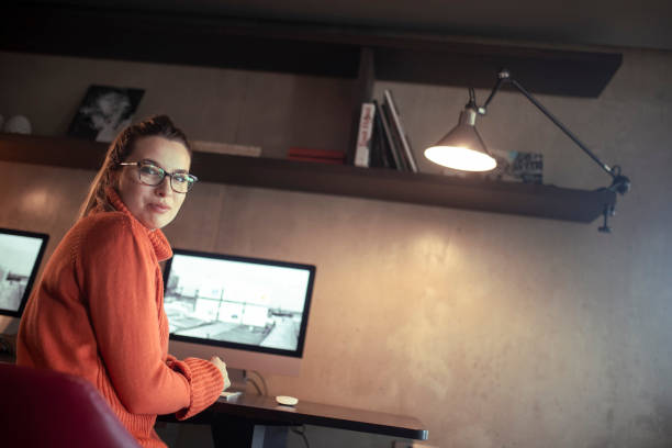 istock A portrait of a young programmer sitting in front of a computer. 1385087660