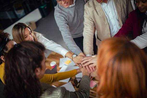 istock All for one and one for all! A group of architects celebrates a successfully completed project. 1385087671