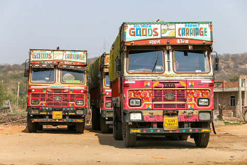 Rajasthan, India - March 3, 2022: Bright trucks Tata 2518c at an interurban road.