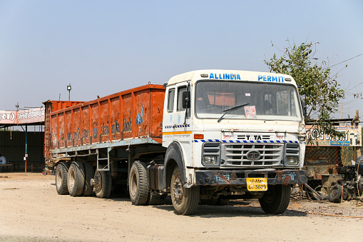 Rajasthan, India - March 3, 2022: White semi-trailer truck Tata LPT at an interurban road.