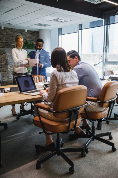 istock Team of diligent business people working in a co-working office space 1385088799