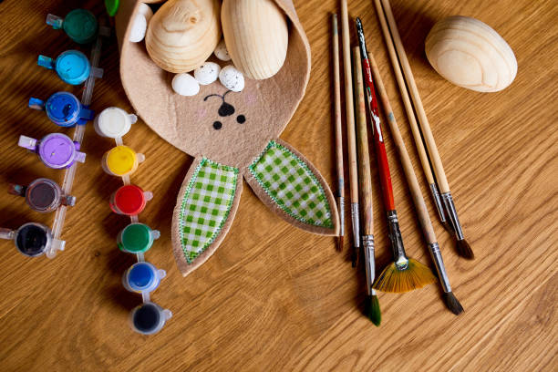 istock Top view pack of eggs with brush, paint and decorative elements 1385090298