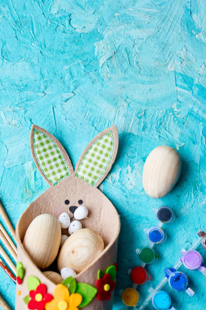 istock Top view pack of eggs with brush, paint and decorative elements 1385090322