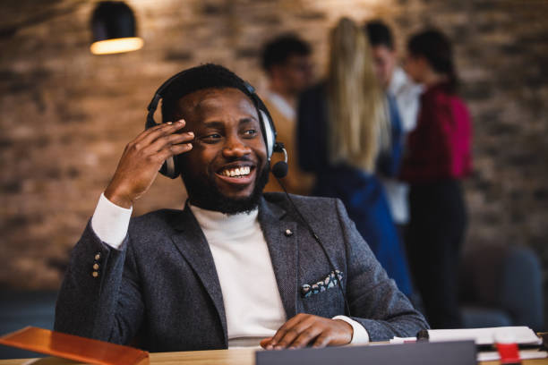 istock Confident businessman wearing a headset, on the conference call 1385091836
