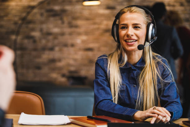 istock Copy space shot of confident customer support agent with a headset talking on the phone 1385091952