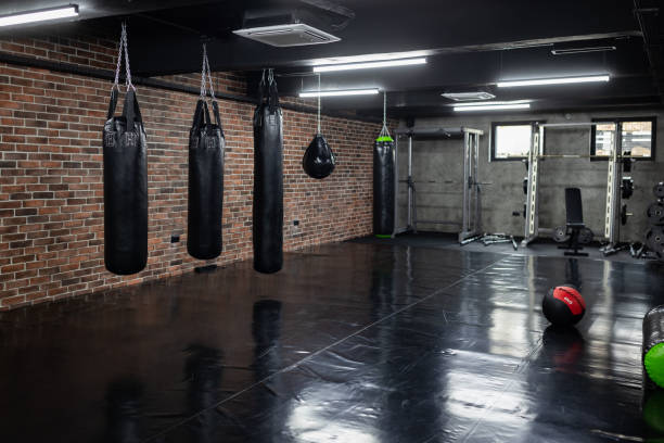 Empty modern gym Empty modern gym with sports exercising equipment boxing gym stock pictures, royalty-free photos & images