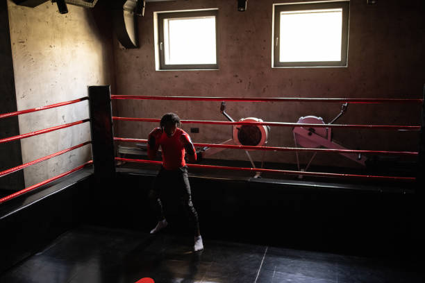 istock Young male boxer Black ethnicity having a training in the boxing ring 1385093644