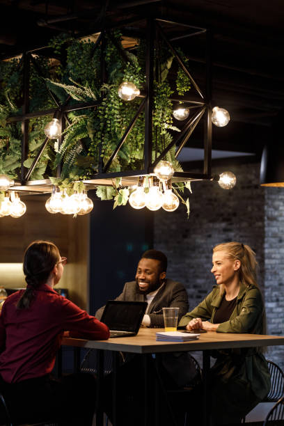 istock Modern break room and three business colleagues hanging out during break 1385095127