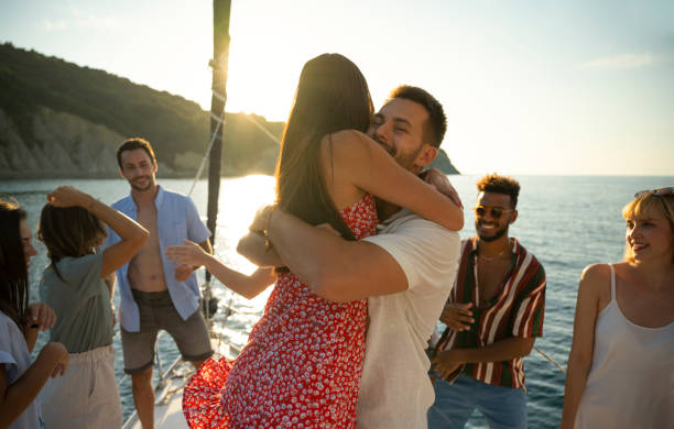 istock Couple embracing on sailboat 1385096047