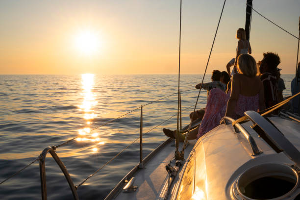 istock Friends looking view on sailboat 1385096059