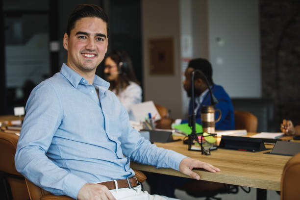 istock Confident young White businessman looking and smiling at camera 1385096710
