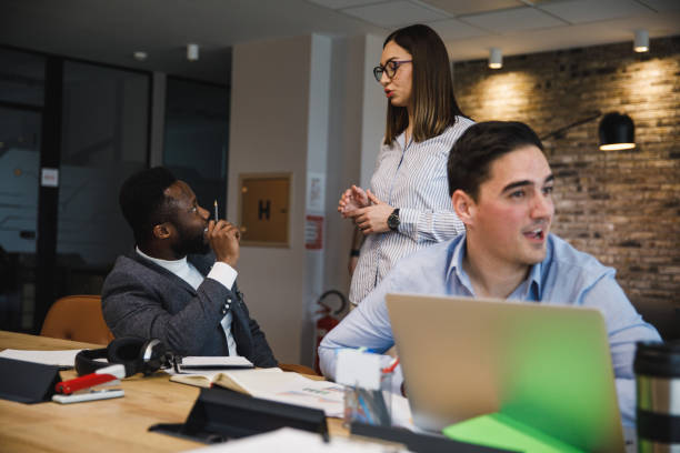 istock Business colleagues discussing new project ideas in a co-working office space 1385096725