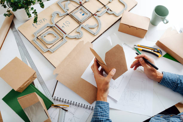 istock Hands holding a box in hands, thinking process on ways to improve it. 1385096917