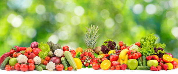 istock Collage fresh colored vegetables, fruits, berries on green background. 1385099835