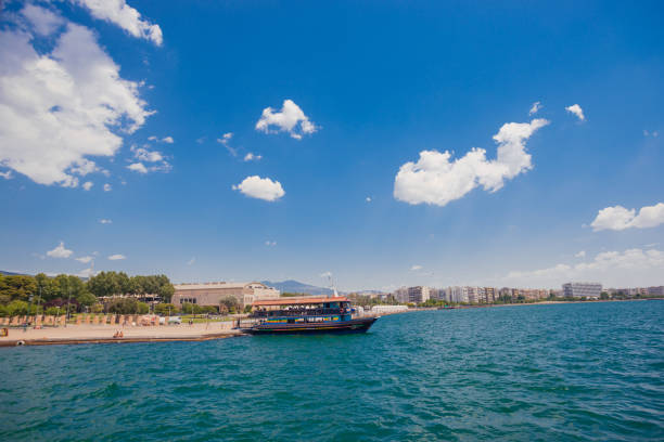 Ship rests at the dock in calm blue water and clear sky