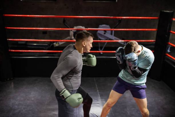 istock Together male boxers having a training in the boxing ring 1385100795