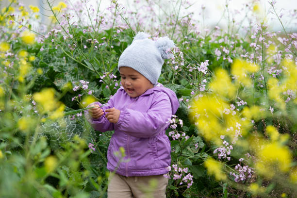 Free Stock Photo of Sweet baby girl in a meadow with wild spring ...