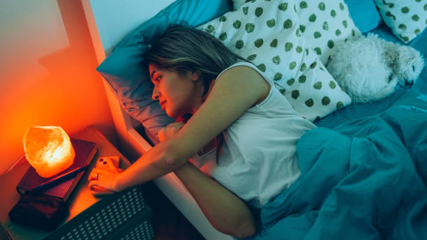 istock Depressed woman at home using smartphone 1385101363