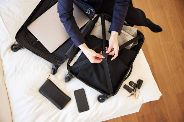 istock A young businesswoman is packing her suitcase 1385102373